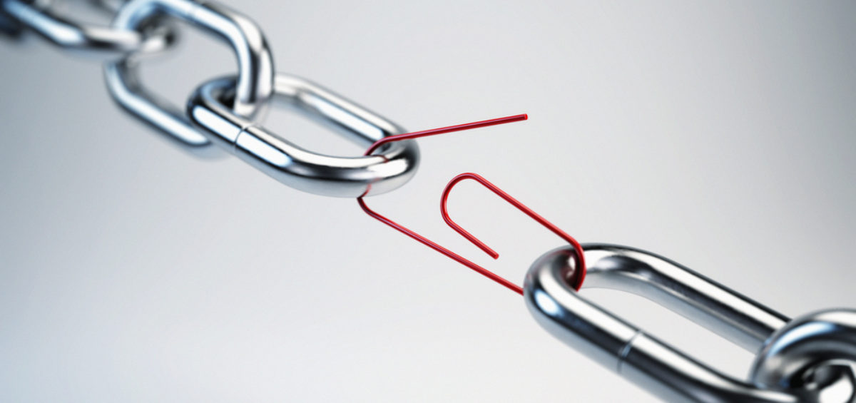 Picture of a chain link linked by a red paper clip