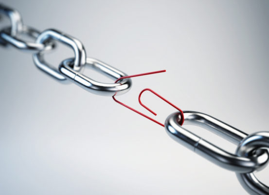 Picture of a chain link linked by a red paper clip